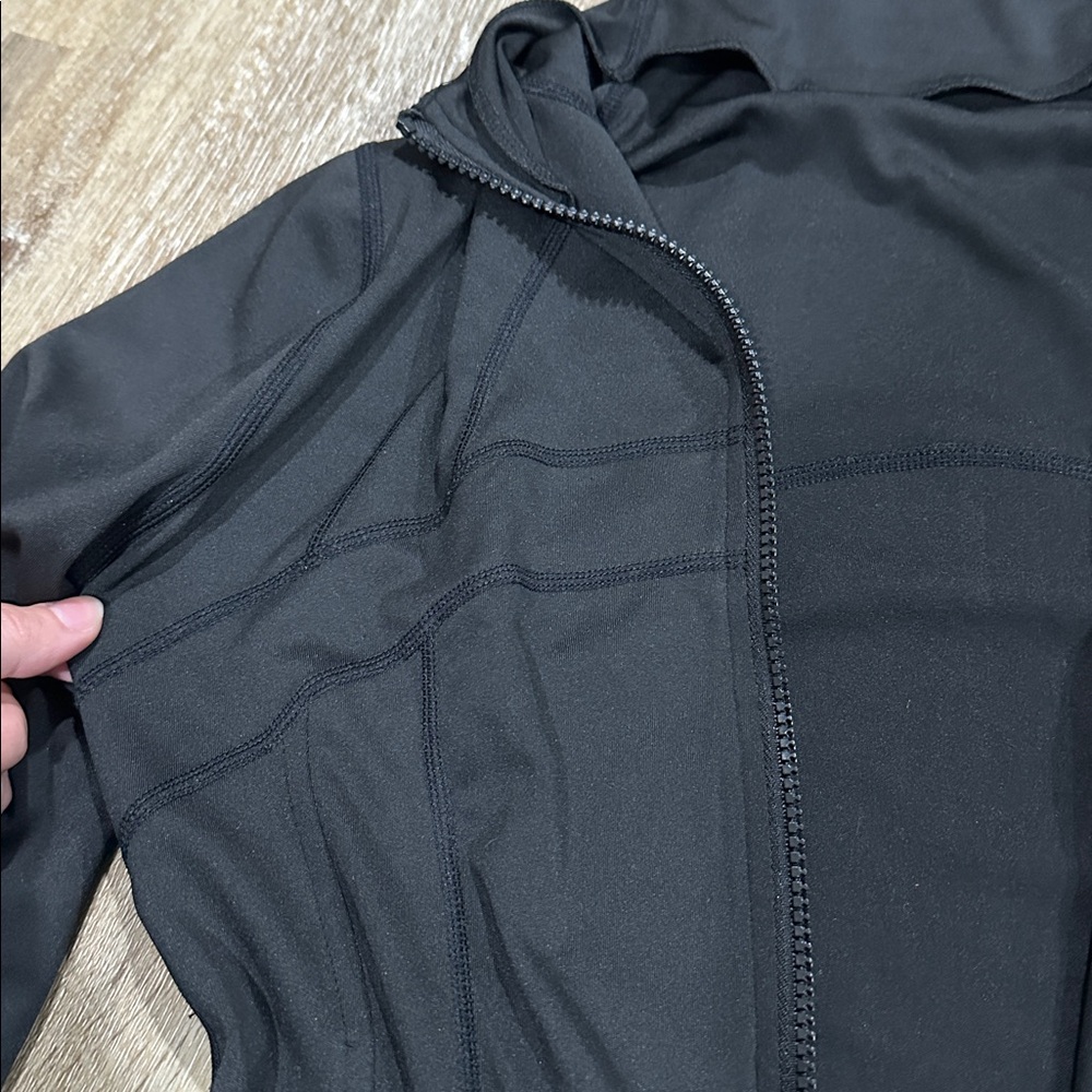 Women's Black running jacket with thumb holes. - light with pockets - Picture 3 of 3